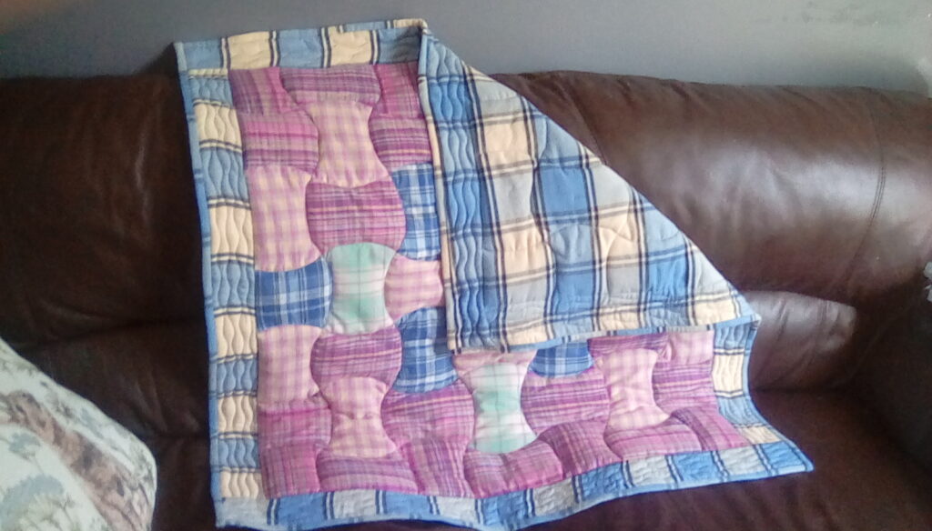 Plaid applecore patchwork lap quilt
