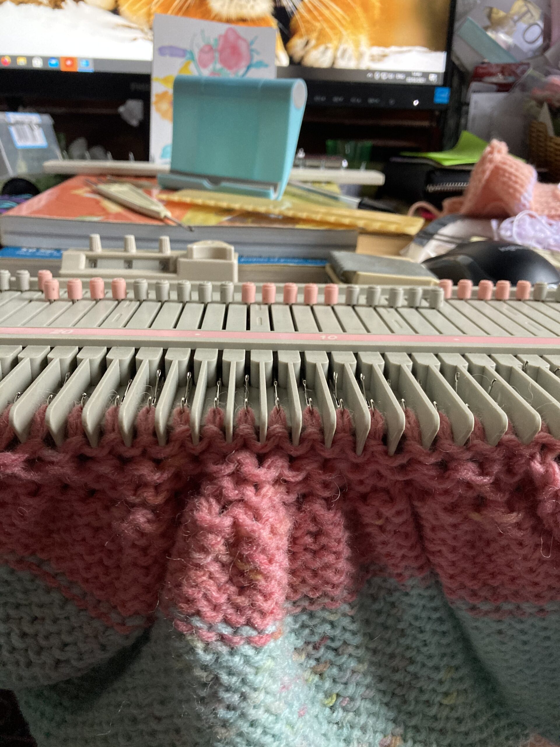 Photo of knitting on the Zippy90 with the gathered effect of the decreased stitches being shown